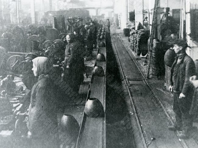 Conveyor with parts for projectiles for rocket artillery combat vehicles in workshop No. 10 of the Lysva Metallurgical Plant