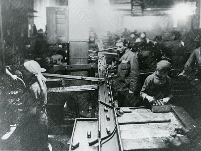 Workers of shop No. 14 of the Lysva Metallurgical Plant manufacturing parts for shells